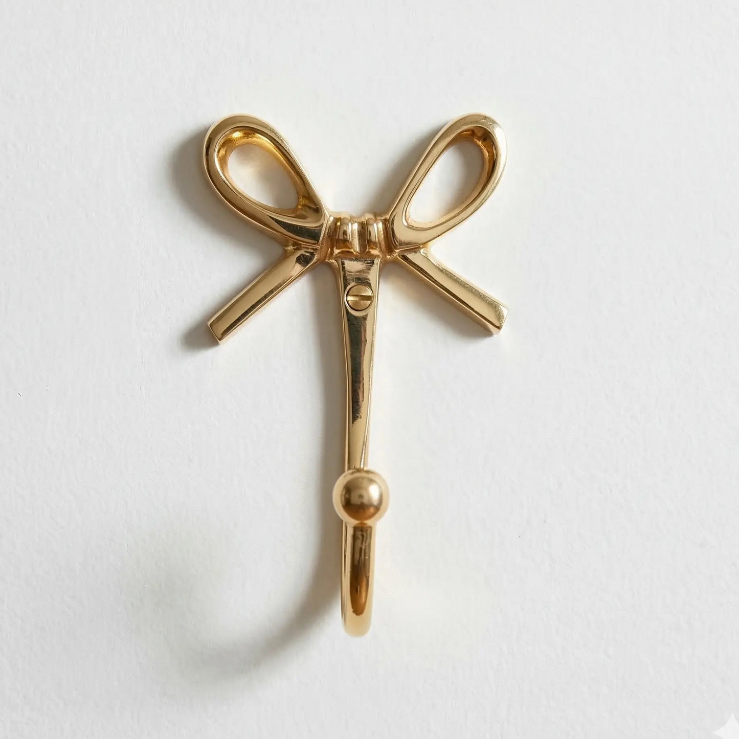 Crochet mural décoratif doré en forme de noeud - TokoLausanne