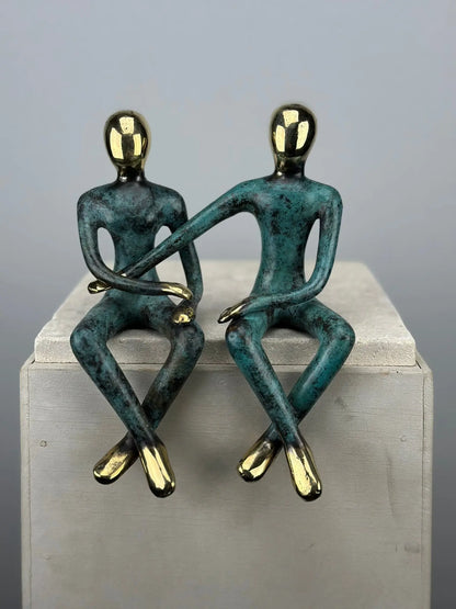 Sculpture du couple assis en bronze TokoLausanne 