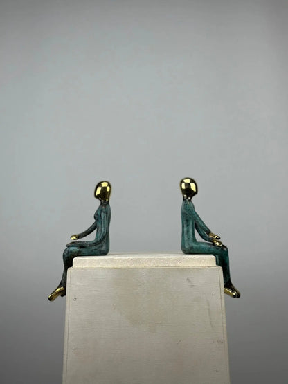 Sculpture du couple assis en bronze TokoLausanne 