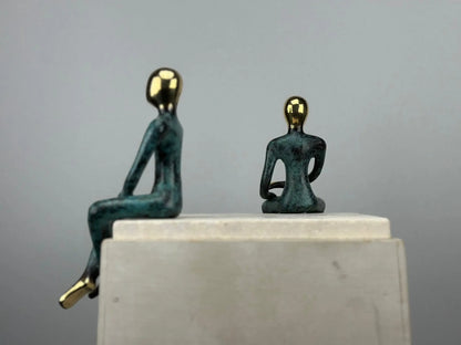 Sculpture du couple assis en bronze TokoLausanne 