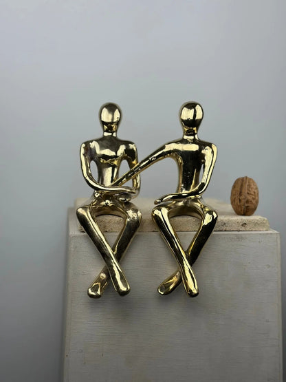 Sculpture du couple assis en bronze doré
