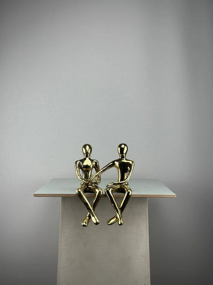 Sculpture du couple assis en bronze doré