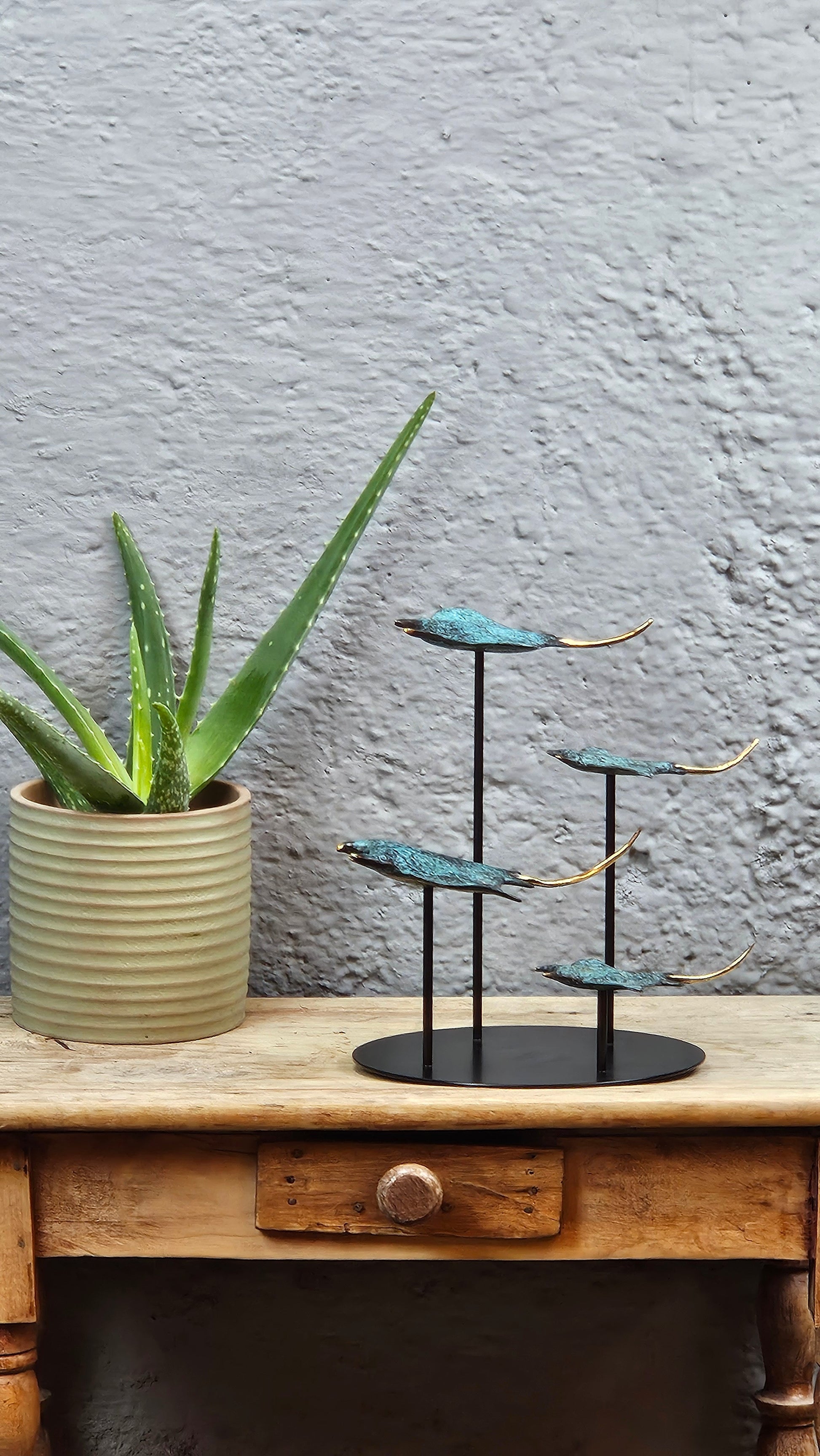 4 raies manta en bronze socle rond Tokolausanne