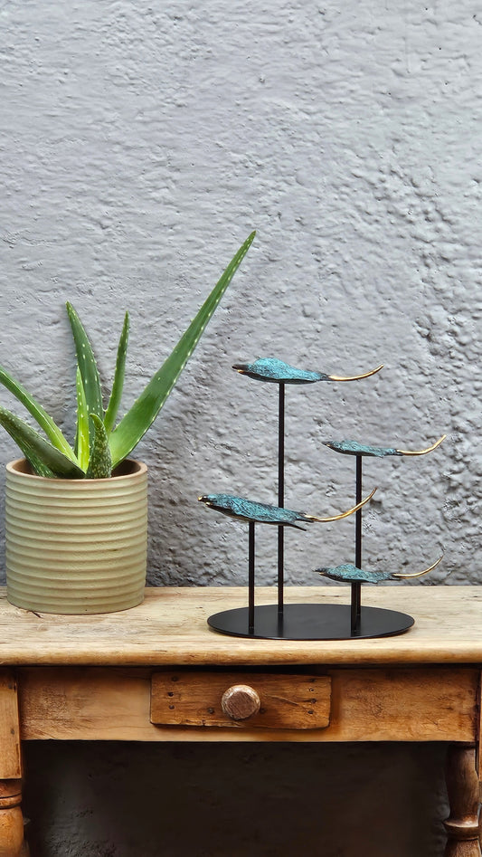 4 raies manta en bronze socle rond Tokolausanne