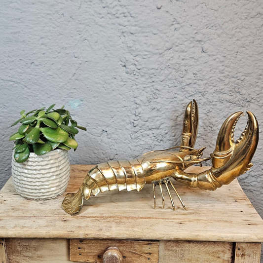 Homard en bronze doré : sculpture raffinée et symbolique puissante